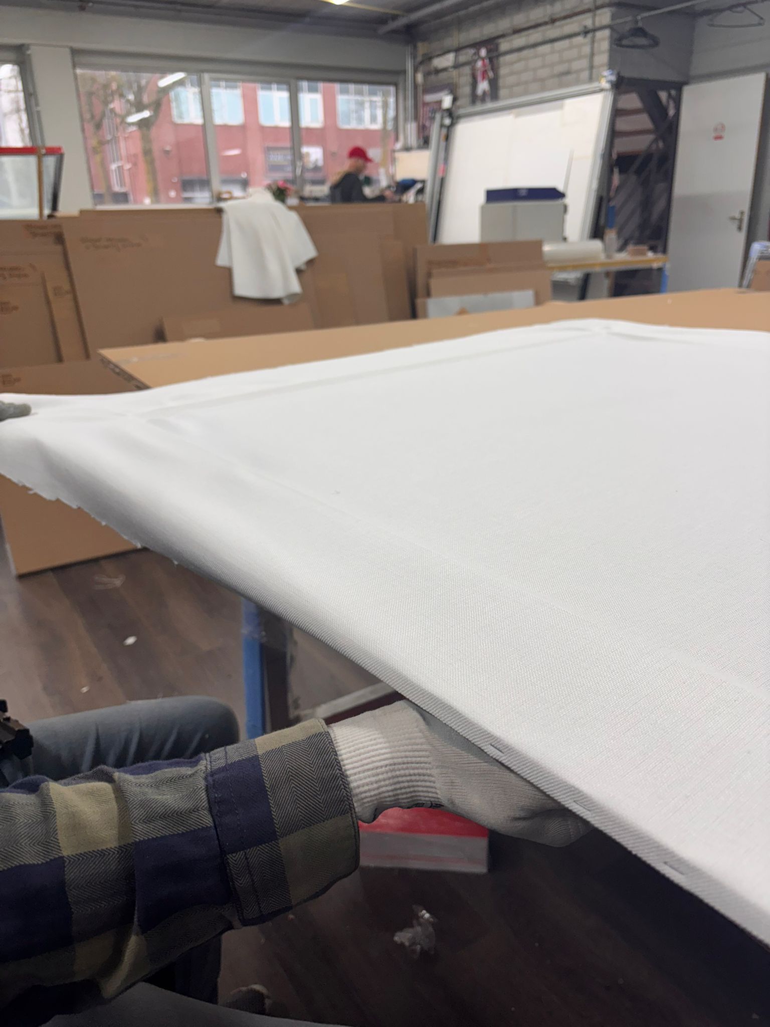 Archival fabric backing being prepared by hand